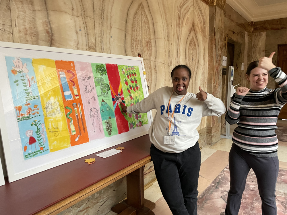 Sahra and Kelly in front of artwork