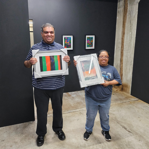 Students with their artwork