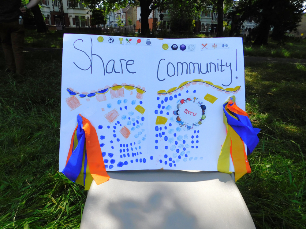 Homemade sign saying Share Community