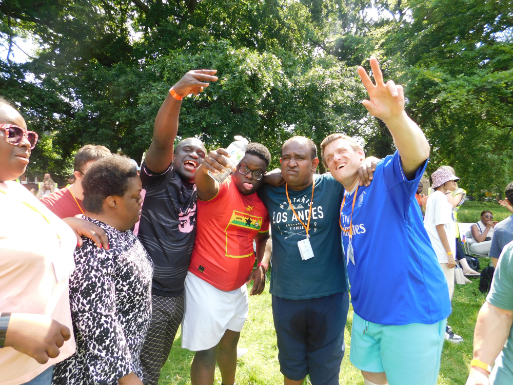 A group of Share students smiling and waving