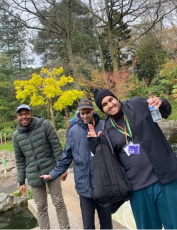 Three men pose for the camera in Kyoto Gardens in Holland Park