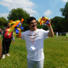 A man shaking cheerleading paper decorations