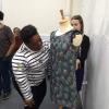 Gifty dressing the mannequin